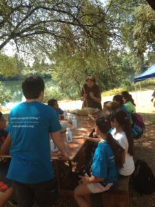 Class learning around picnic table
