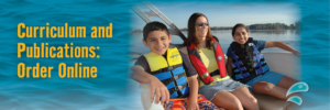 Family wearing lifejackets in a boat