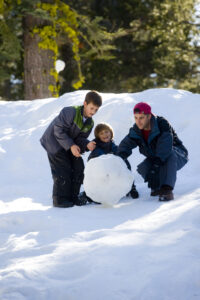 Family making snowman