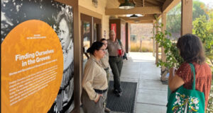 UC Riverside and State Parks team gathered in front of the Visitor Center showcasing the exhibit “Finding Ourselves in the Groves.”