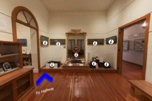 A historic room with paintings and artifacts pertaining to the history of transportation