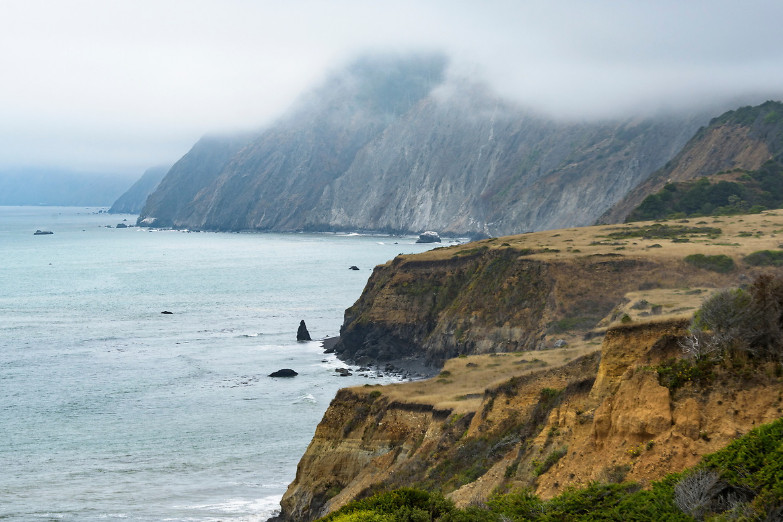 A view of the cliffs, sea, and fog at Sinkyone Wilderness State Park.