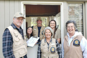 A group of volunteers pose for a picture